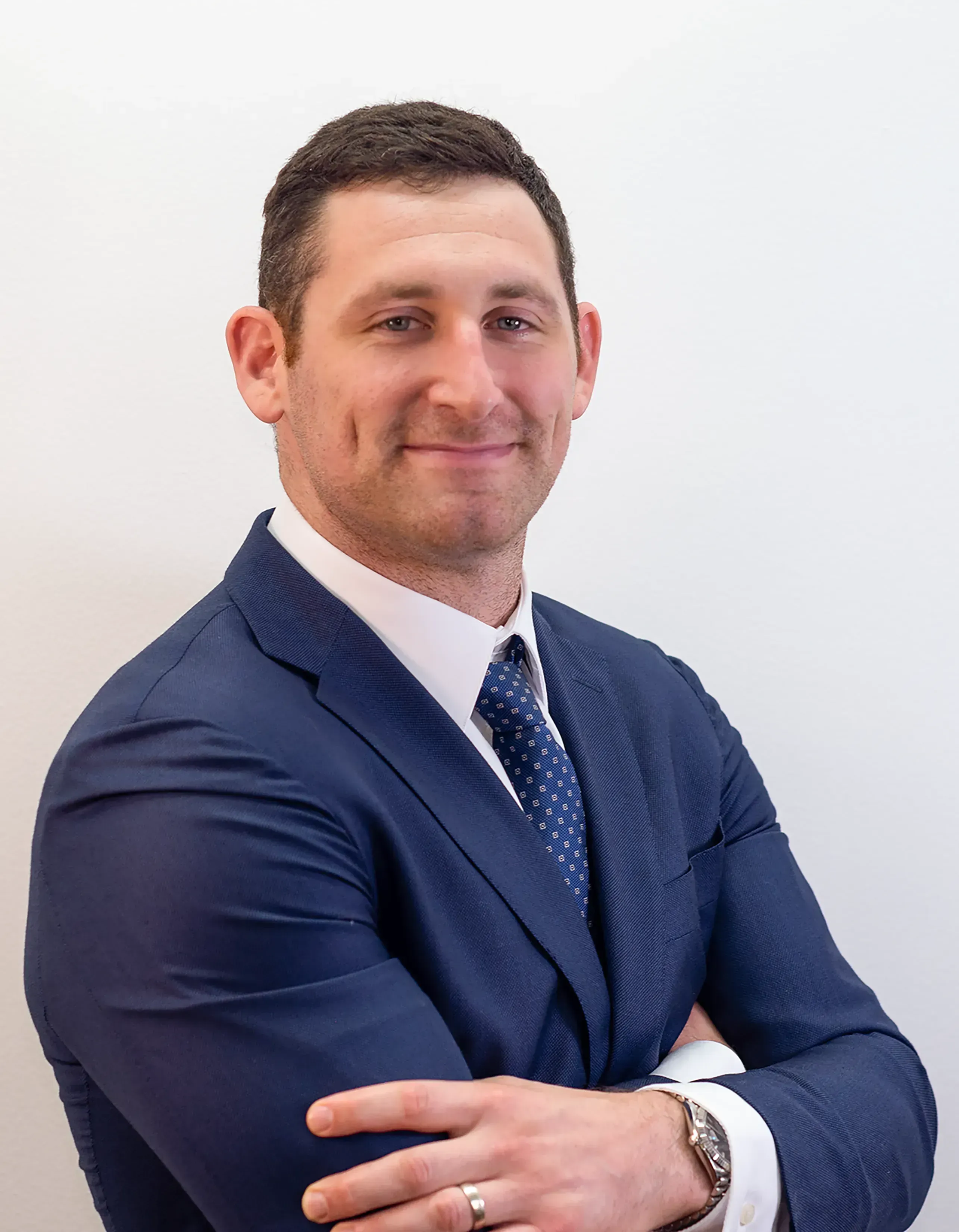 Motorcycle injury lawyer Alex Senft, posing confidently with a smile.