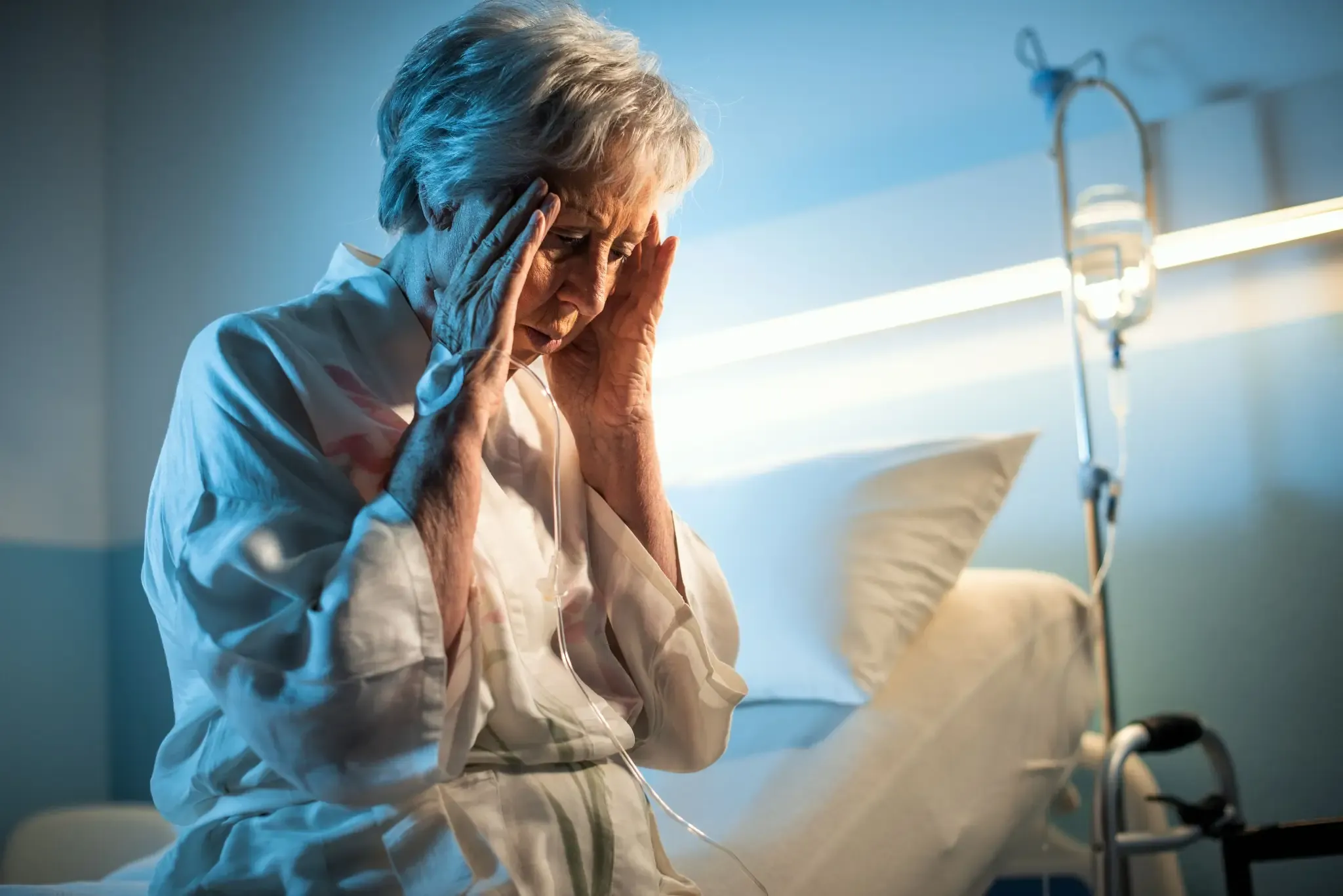 A distressed woman in pain due to neglect, considering suing her nursing home for negligence.