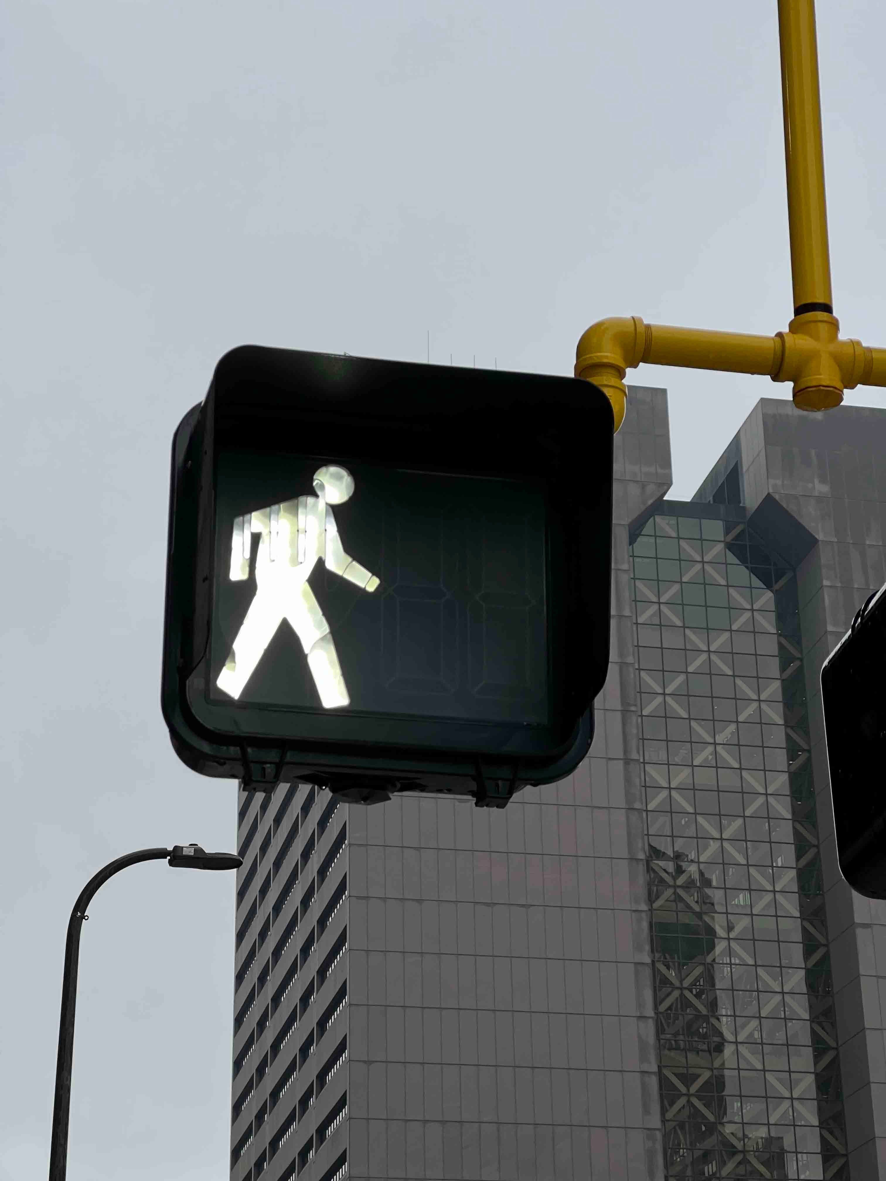 A walk signal intended to prevent pedestrian accidents.